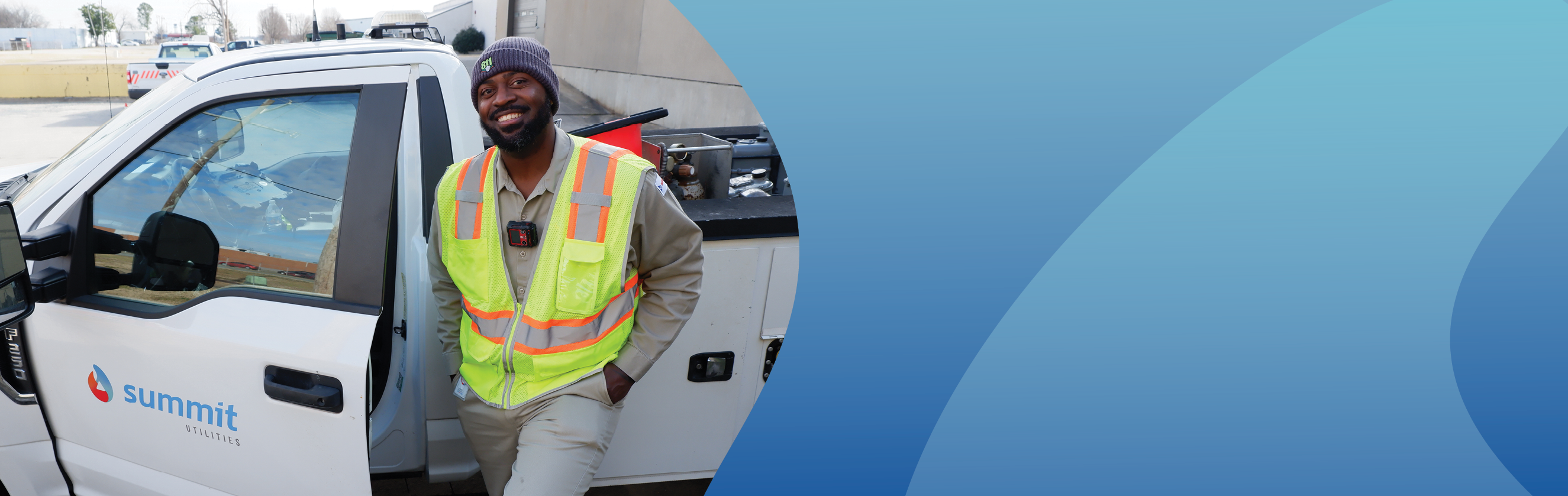 Happy employee standing next to truck